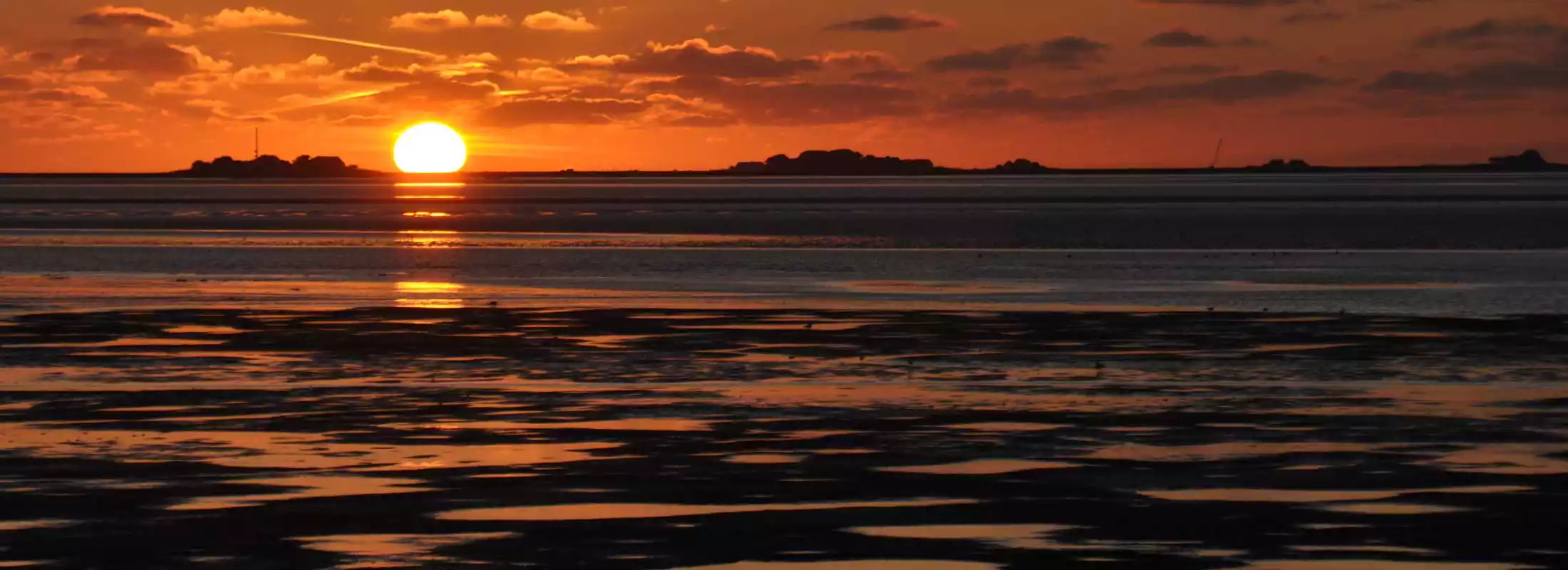 Sonnenuntergang über dem Watt vor Pellworm